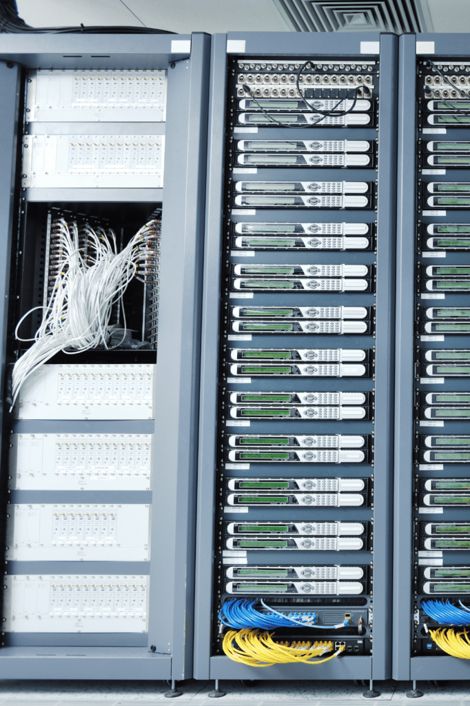 Data center server racks with network equipment - on-premise phone system failover infrastructure